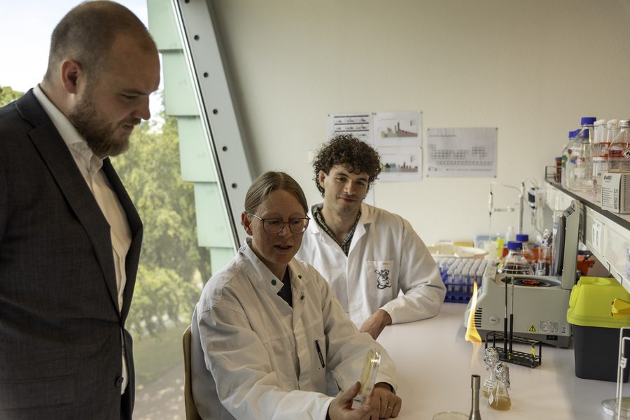 Researchers discussing results in the laboratory